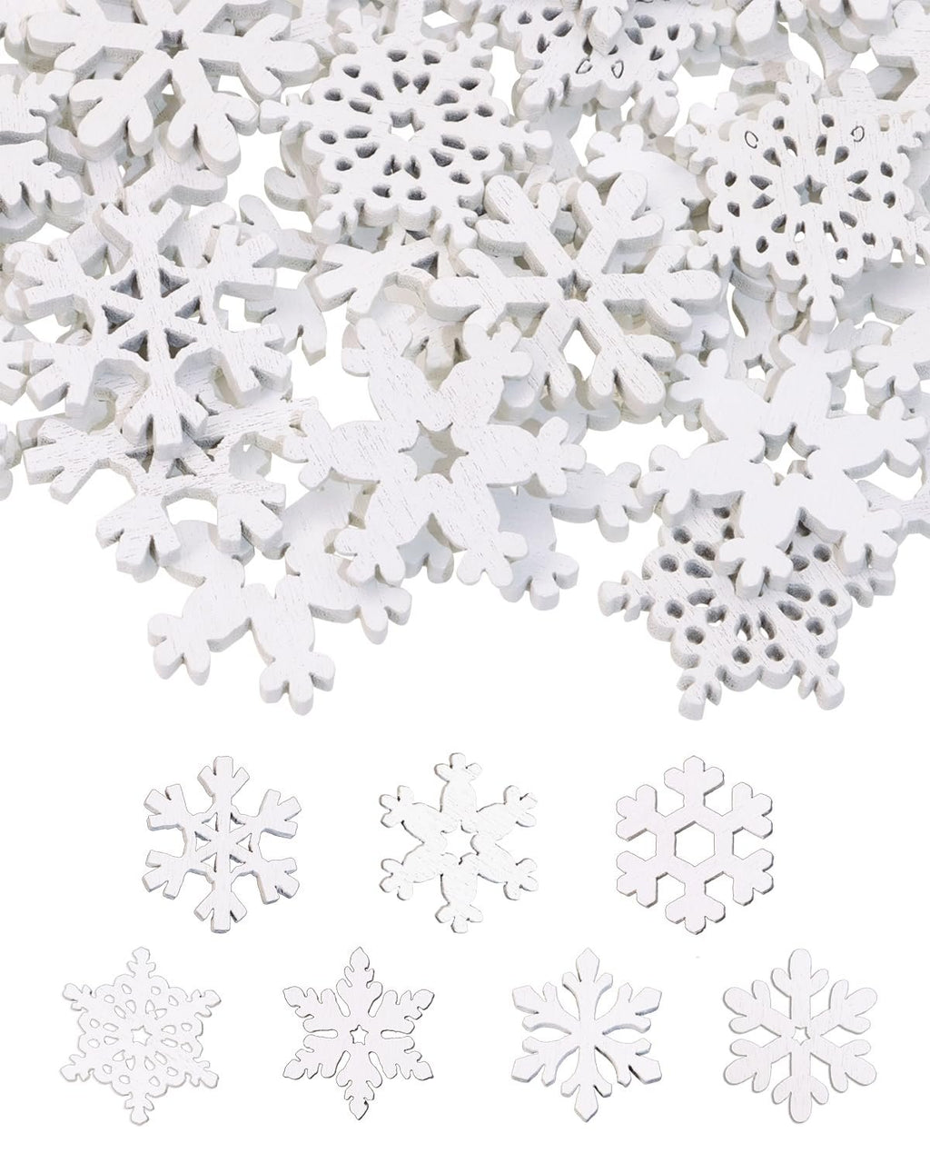 Pile of white wooden snowflake cutouts with a few individual snowflakes arranged below on a white background.