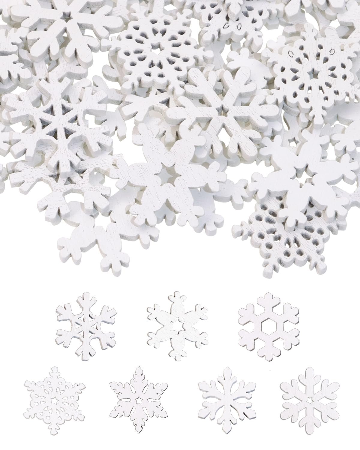 Pile of white wooden snowflake cutouts with a few individual snowflakes arranged below on a white background.
