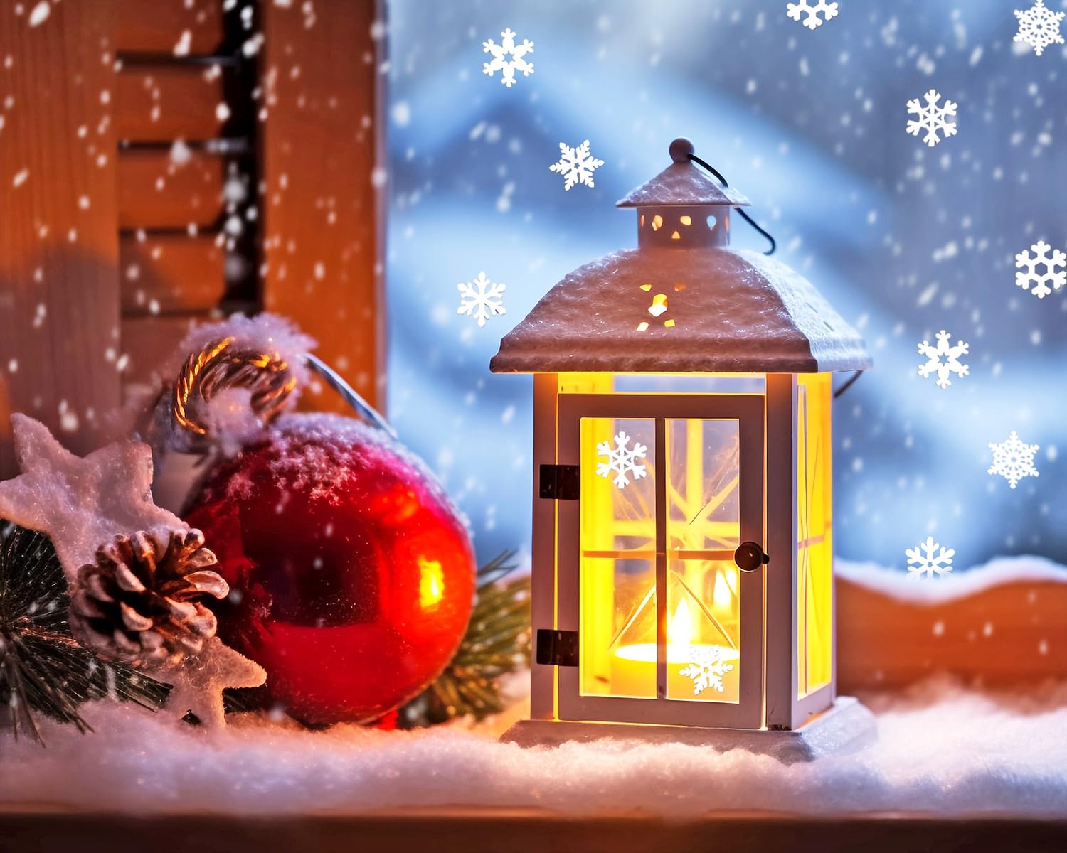 Christmas lantern with a lit candle, red ornament, pinecone, and star decoration in snow
