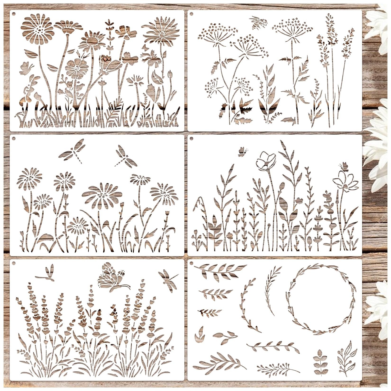 Six reusable stencils with wildflower and botanical designs, arranged in a 2x3 grid on a wooden background.
