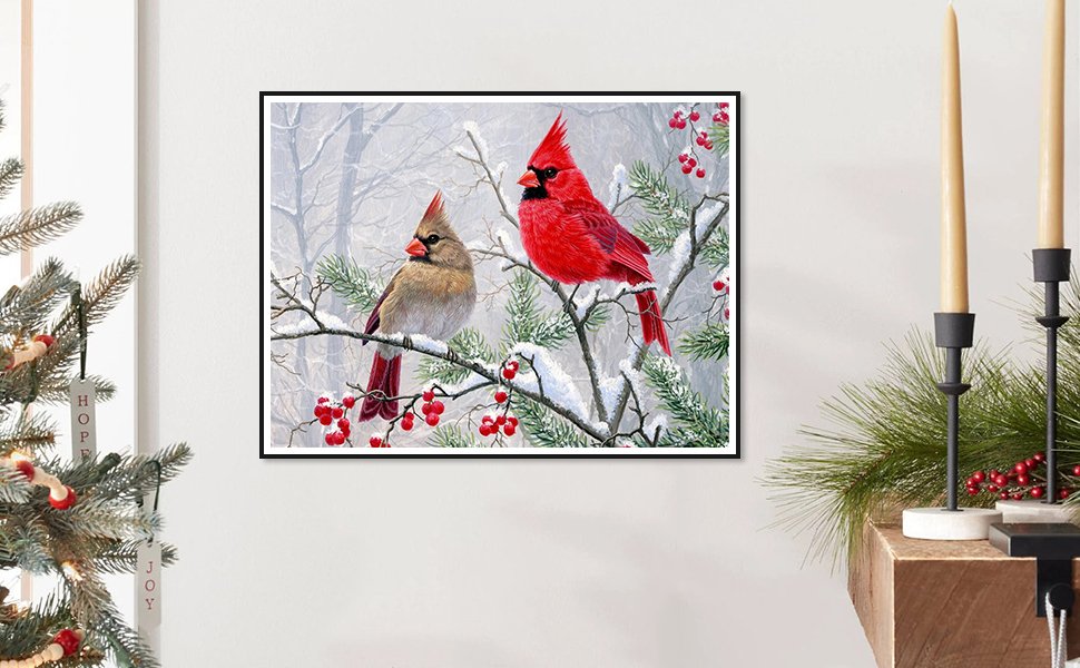 Diamond art painting of two cardinals perched on a snow-covered branch with red berries.