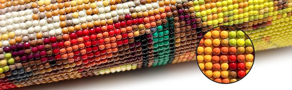 Close-up of a diamond art painting showing colorful beads forming a pattern, with a magnified inset view.