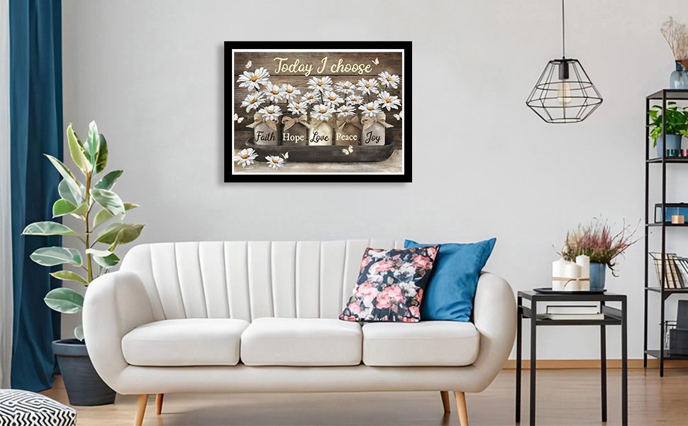 Diamond art painting of daisies in jars with inspirational words, displayed above a sofa.