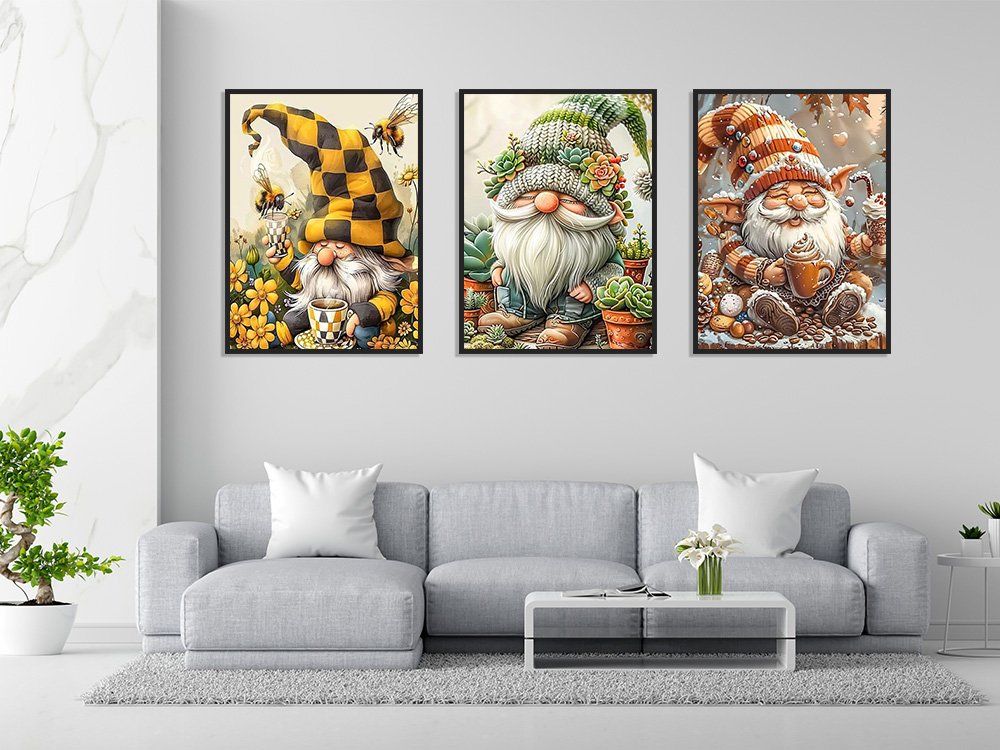 Three framed diamond art paintings of gnomes displayed on a wall above a sofa.