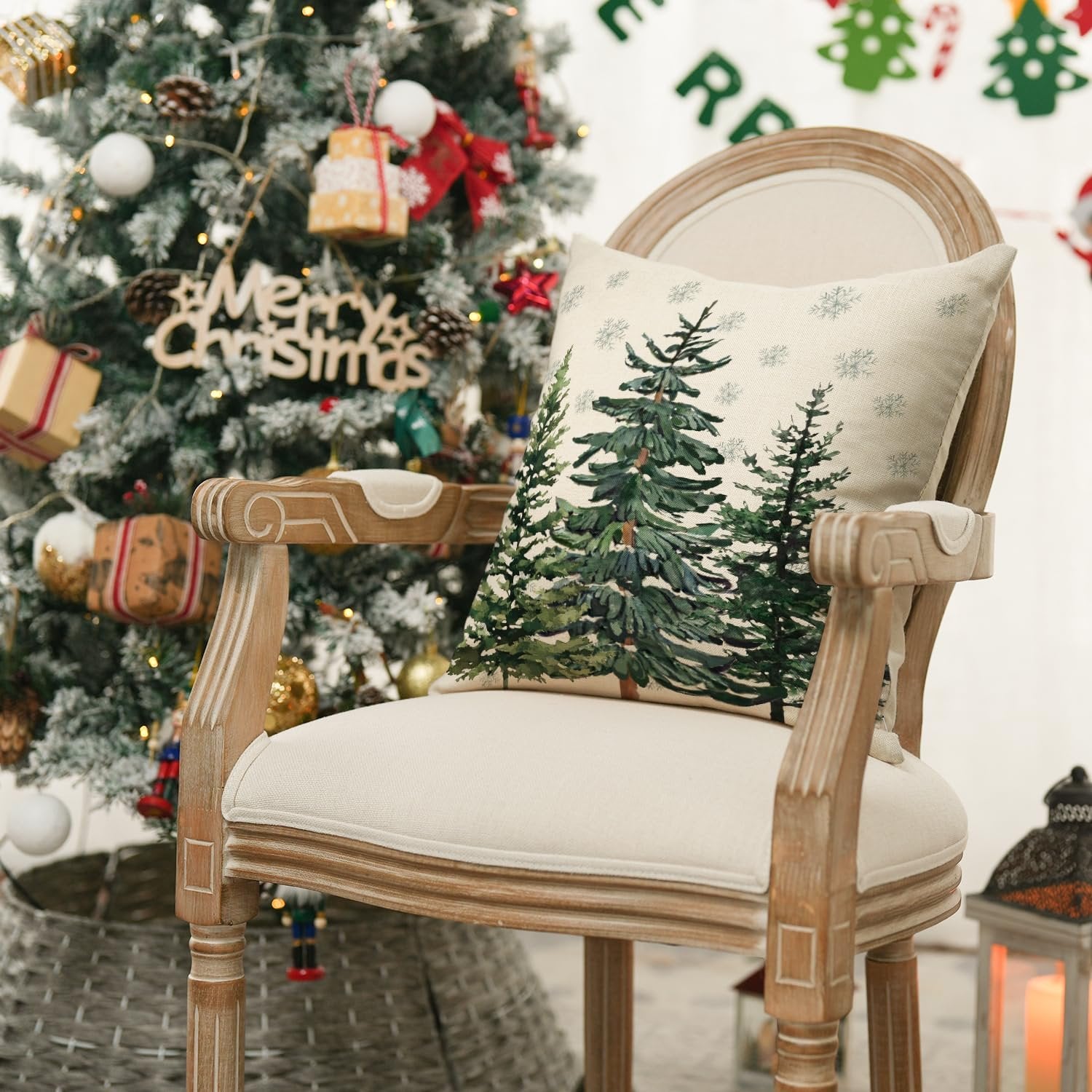 Christmas tree themed throw pillow cover on a chair next to a decorated Christmas tree
