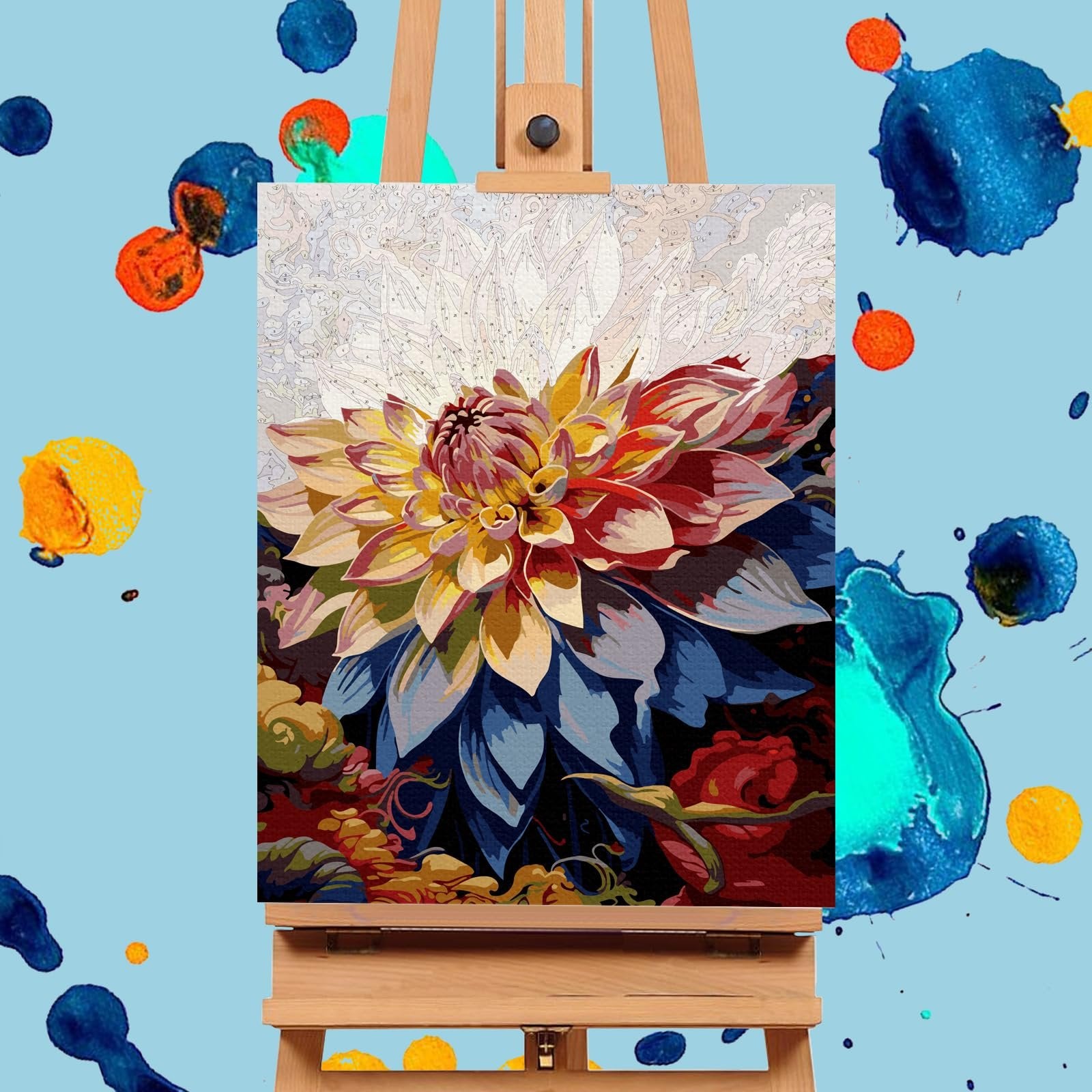 Paint by numbers canvas showing a vibrant dahlia flower on an easel, with colorful paint splatters on a light blue background.