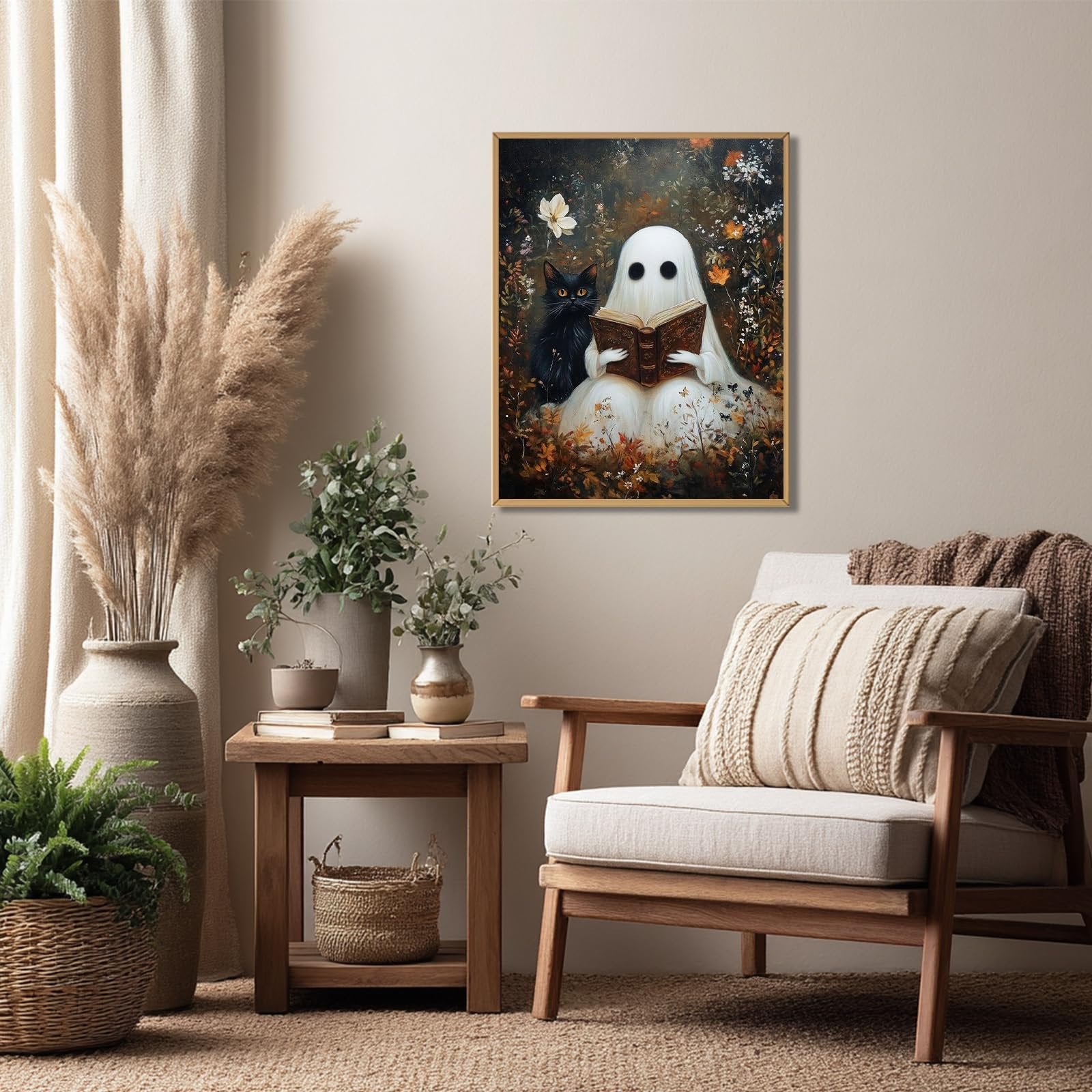 Framed painting of a ghost reading a book with a black cat beside it, displayed in a cozy living room setting.