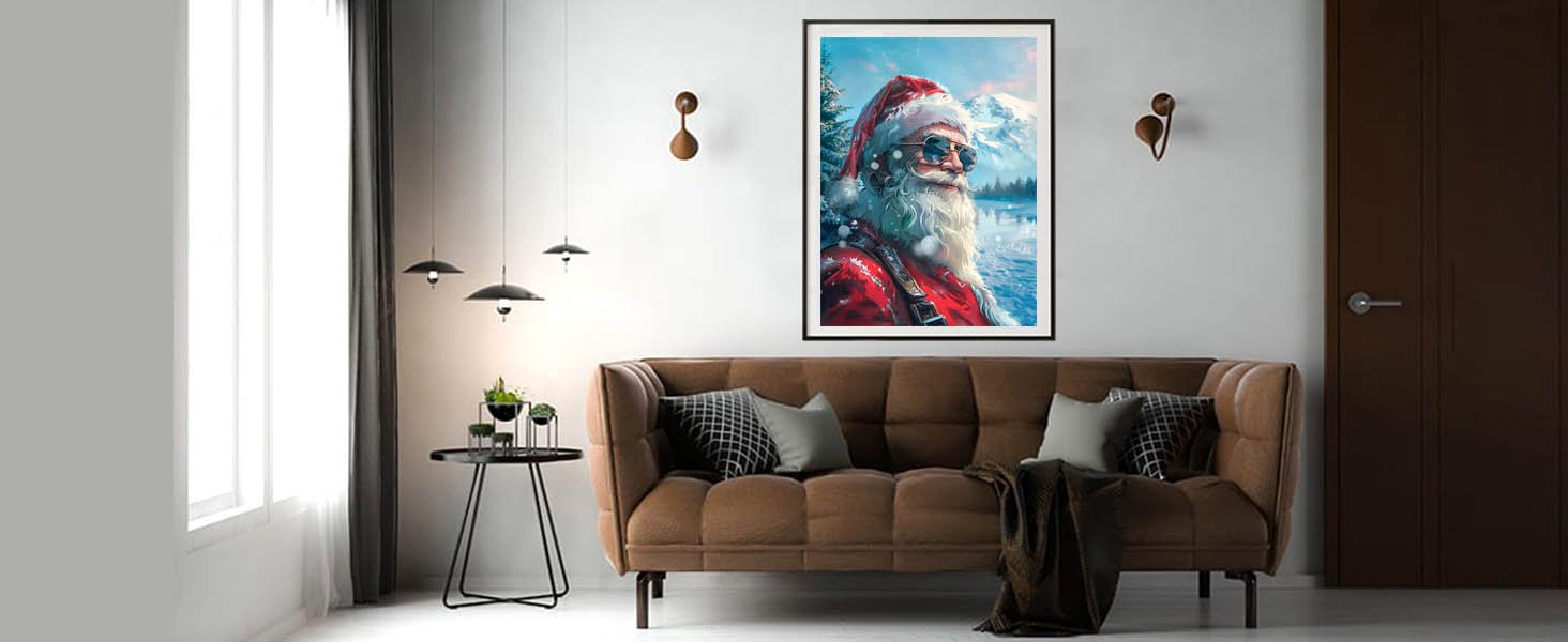 Framed paint by numbers artwork of Santa Claus wearing sunglasses in a snowy landscape, displayed above a sofa.
