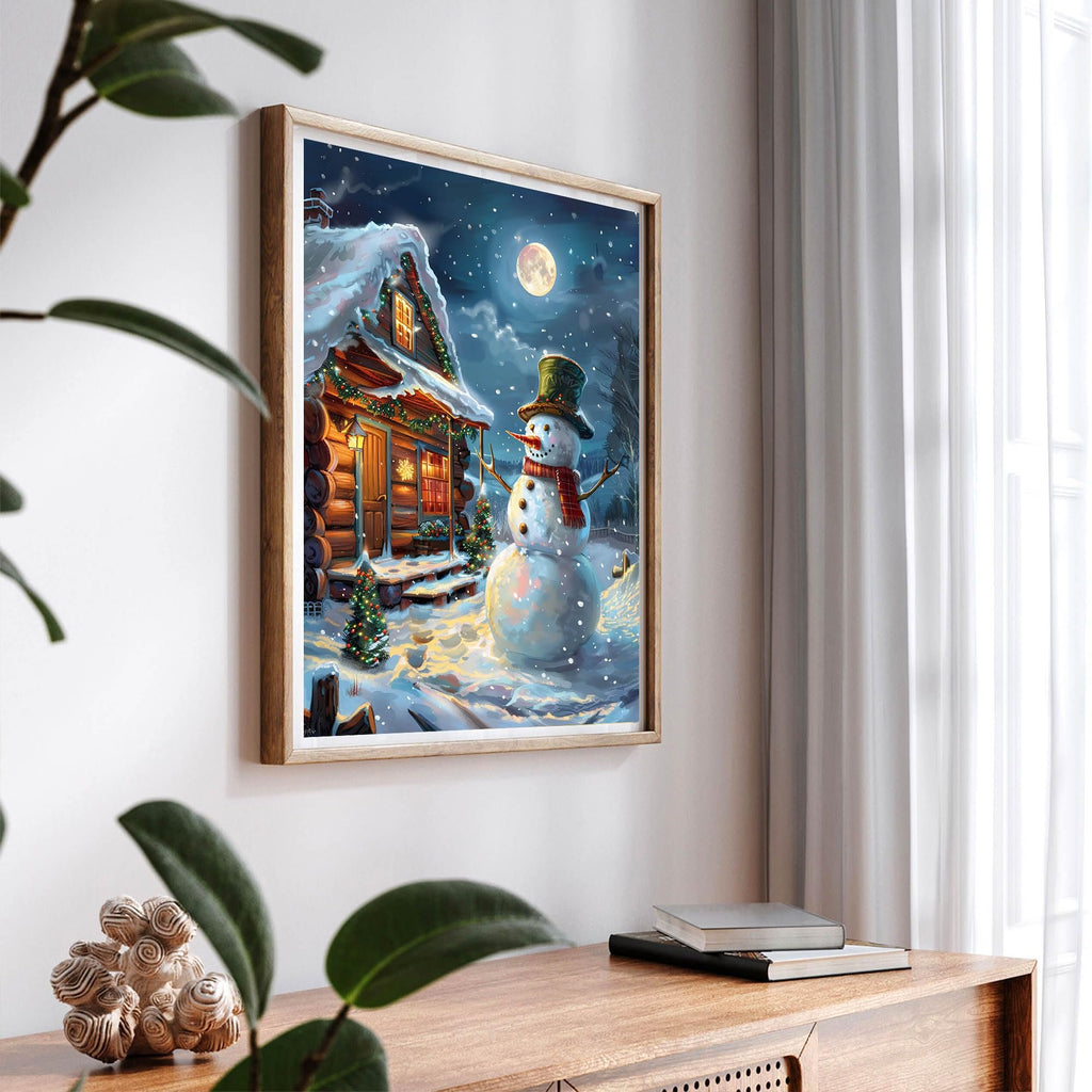 Framed paint by numbers artwork of a snowman and log cabin on a snowy night with a full moon.