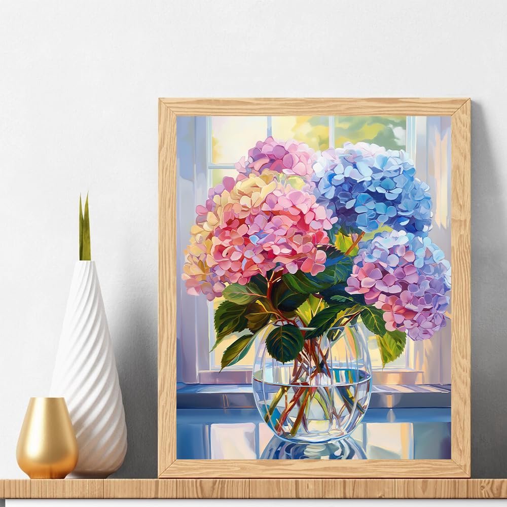 Paint by numbers kit showing colorful hydrangeas in a glass vase by a window, framed.