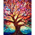 Paint by numbers kit canvas showing a stained glass style tree with colorful leaves and a dark trunk against a bright sky.
