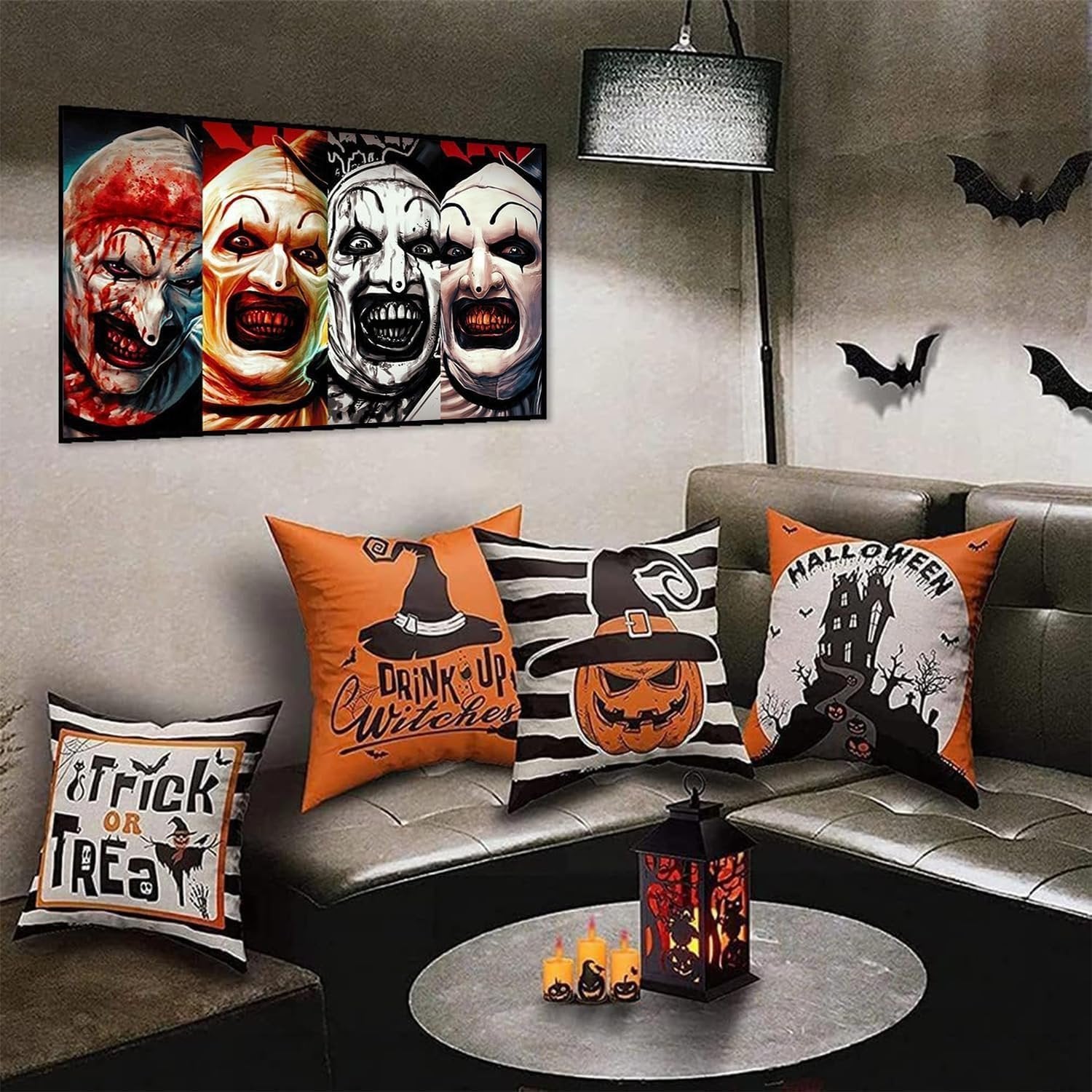 Halloween-themed living room with a painting of four horror clowns and decorative pillows on a sofa.