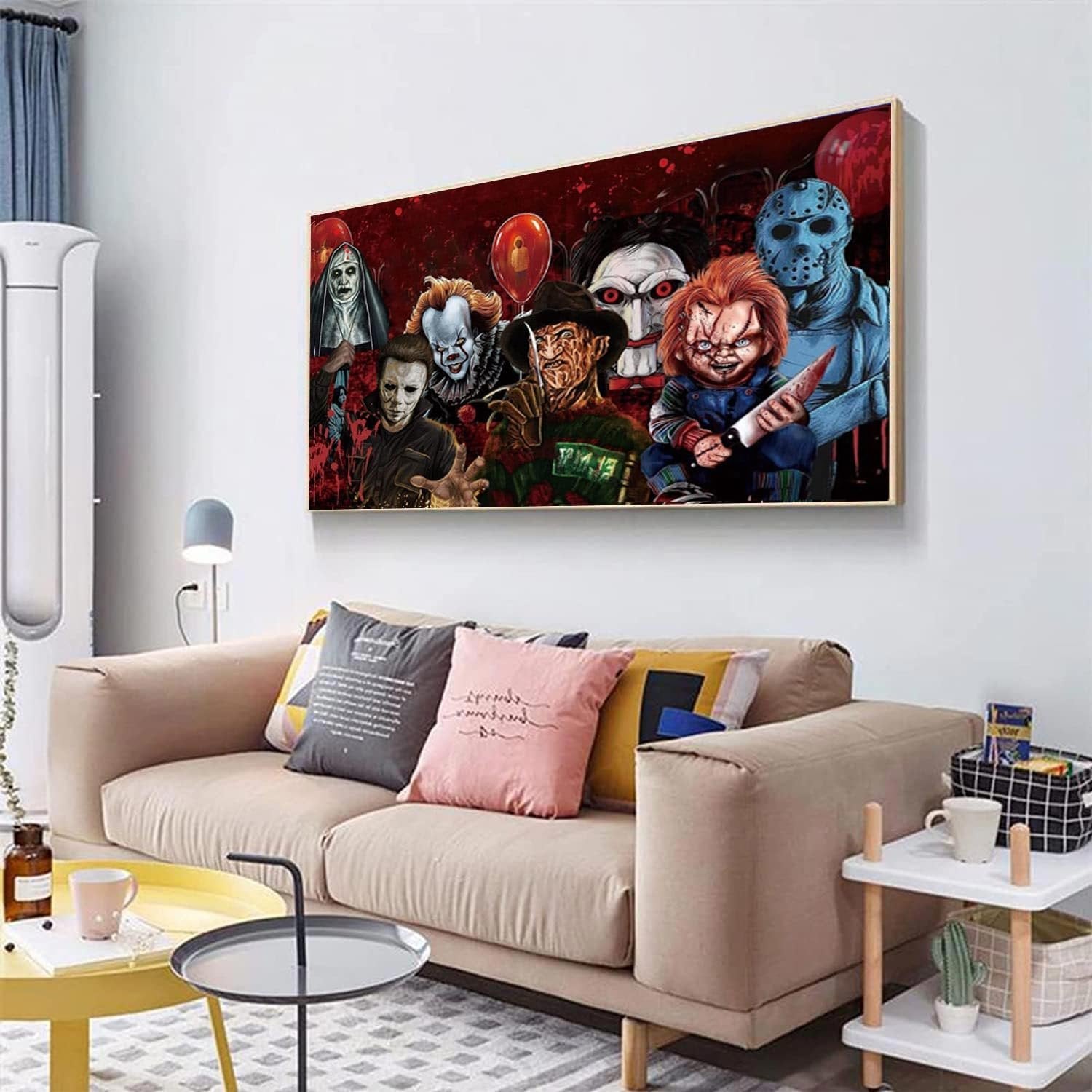 Horror movie characters painted on canvas, framed and hung above a sofa.