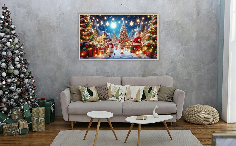 Christmas diamond art kit painting of Santa, snowmen, and decorated trees in a snowy village scene, displayed above a sofa.