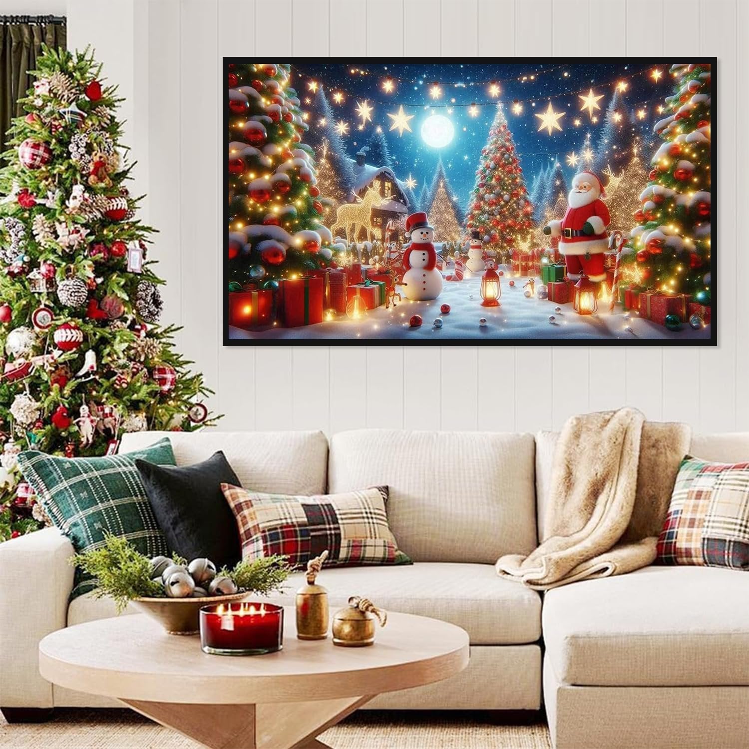 Christmas diamond art kit depicting Santa, snowman, and decorated trees in a snowy village scene, displayed above a sectional sofa.