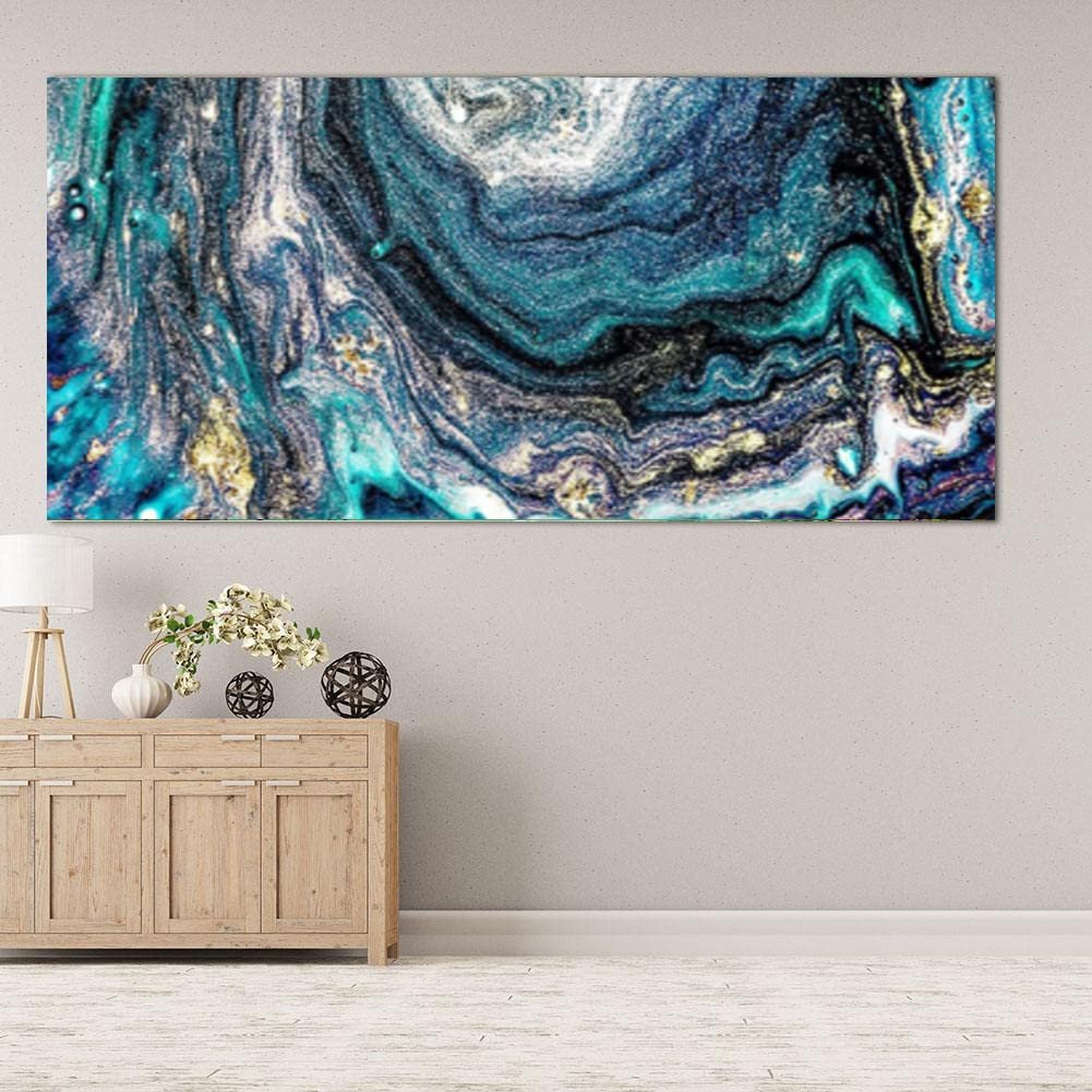 Abstract blue and gold fluid art painting displayed above a wooden credenza with a lamp and decorative spheres.