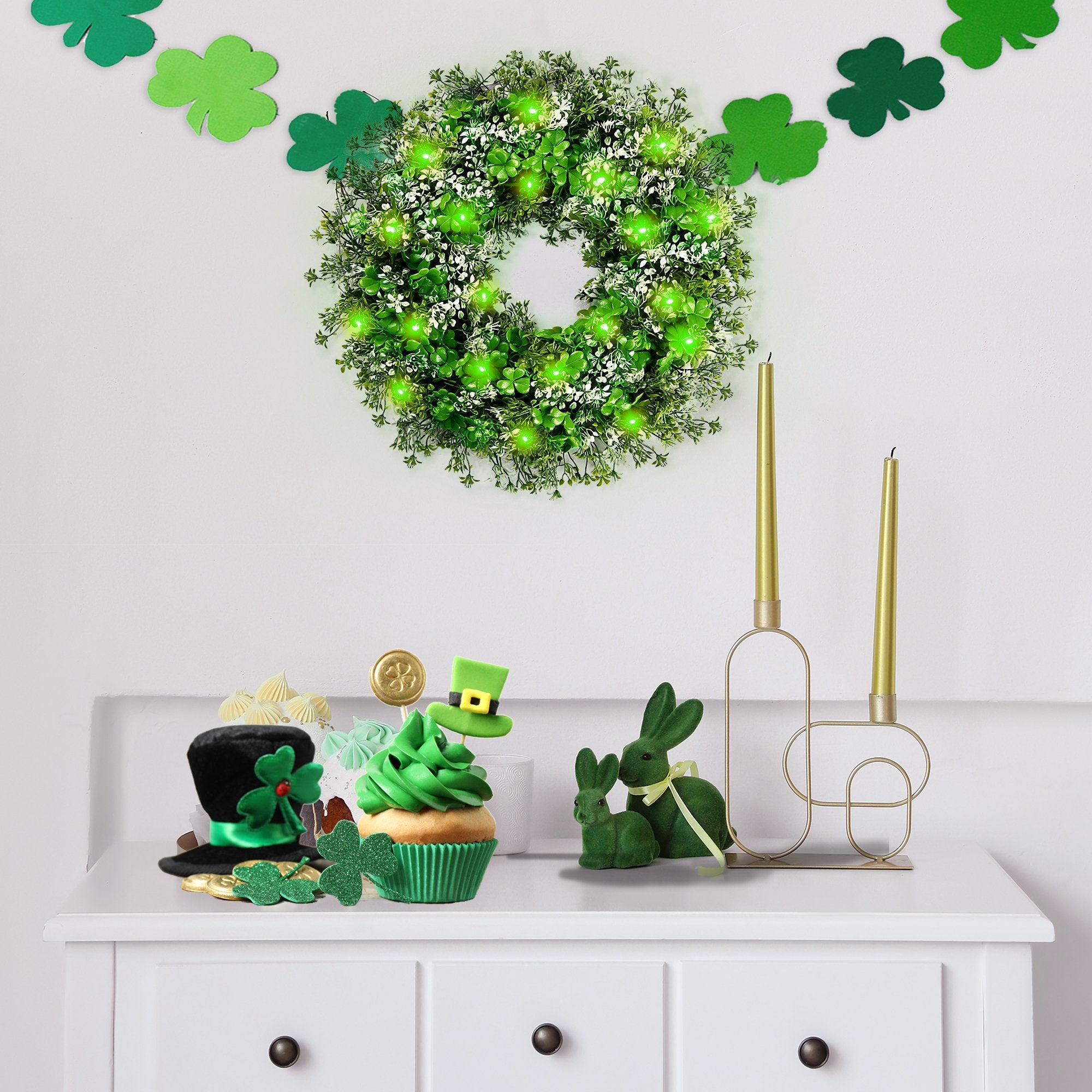St. Patrick's Day themed decorations including a lighted wreath, cupcake, and shamrock garland