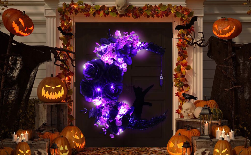 Halloween moon wreath with purple roses and lights on a front door, surrounded by pumpkins and fall garland.