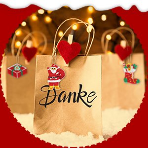 Christmas keychain kit contents with three paper gift bags decorated with Santa, stocking, and gift ornaments, with 'Danke' text on the front bag.