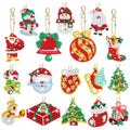 Collection of 17 double-sided diamond art Christmas keychain ornaments featuring Santa, snowmen, bells, ornaments, stockings, candy canes, mittens, sleds, and trees.