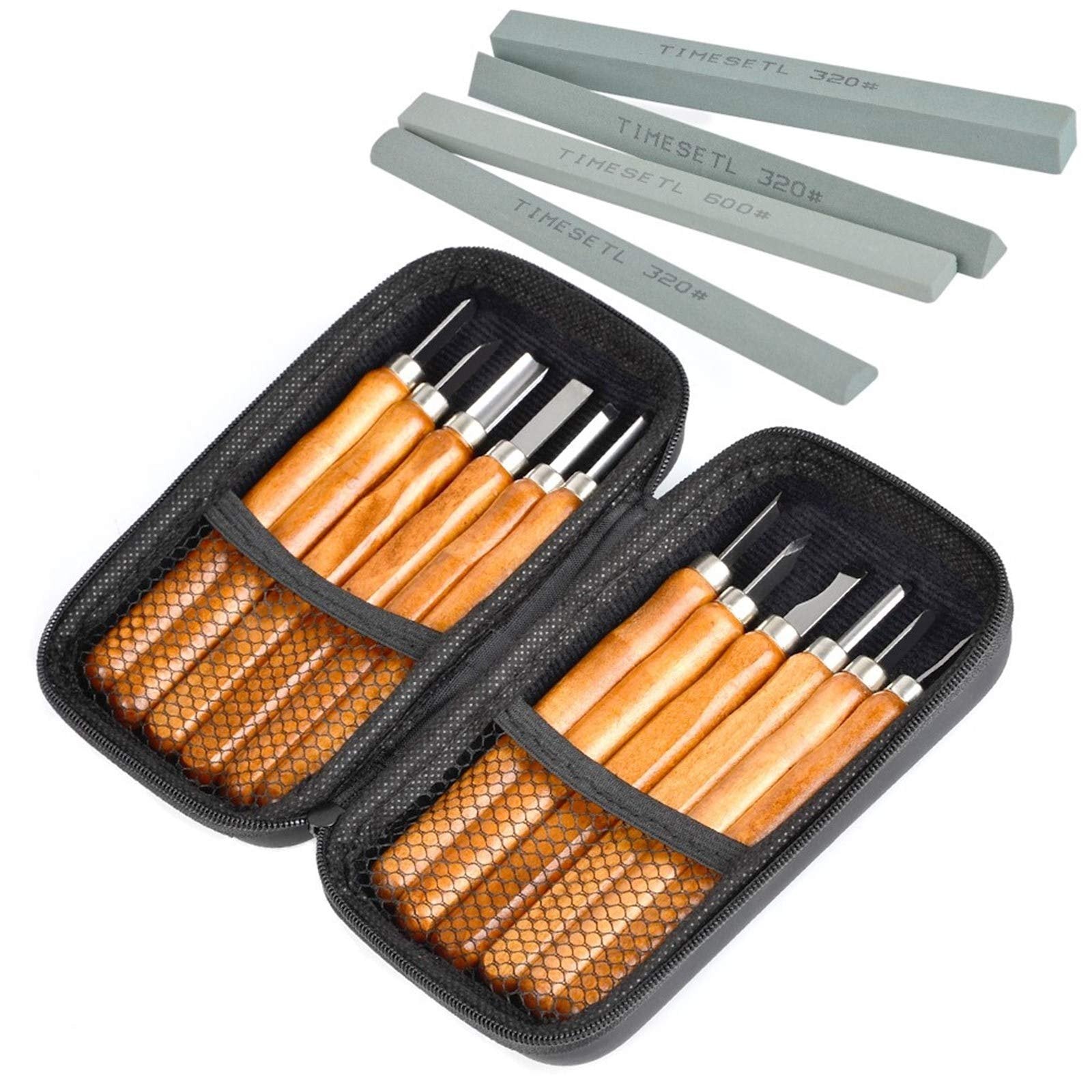 Two black zippered cases open, revealing wood carving tools with wooden handles. Four sharpening stones are arranged above the cases.