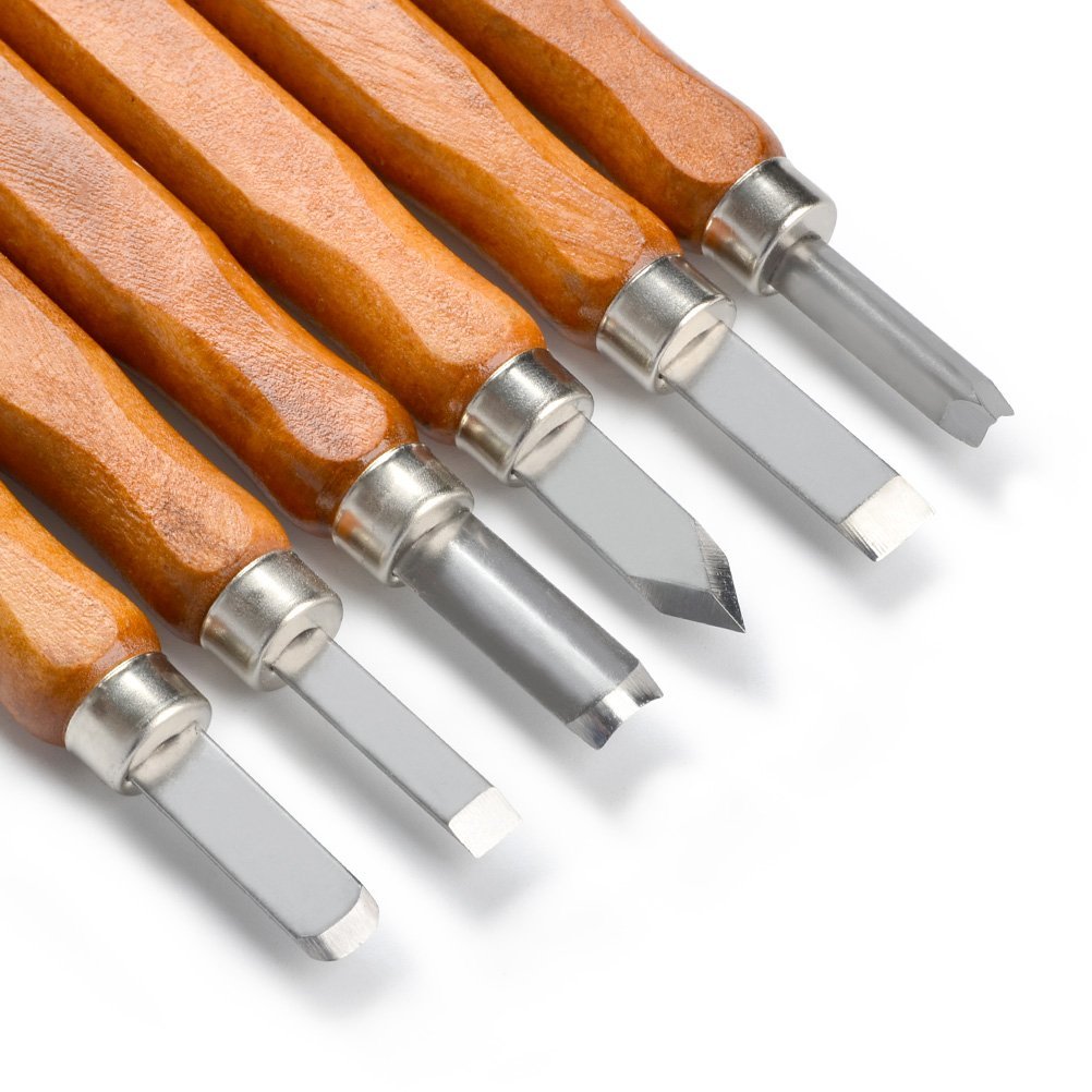Close-up of wood carving tools with wooden handles and steel blades on a white background.