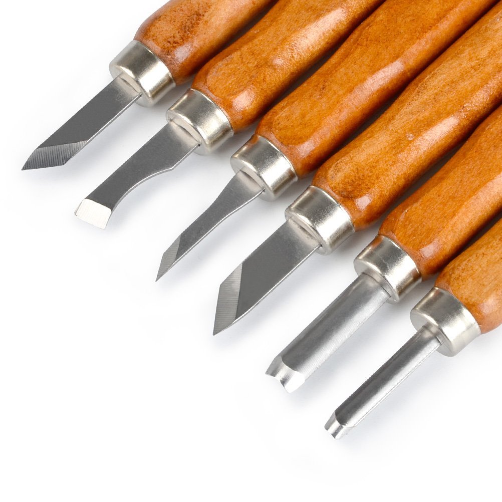 Close-up of six wood carving tools with wooden handles and steel blades on a white background.