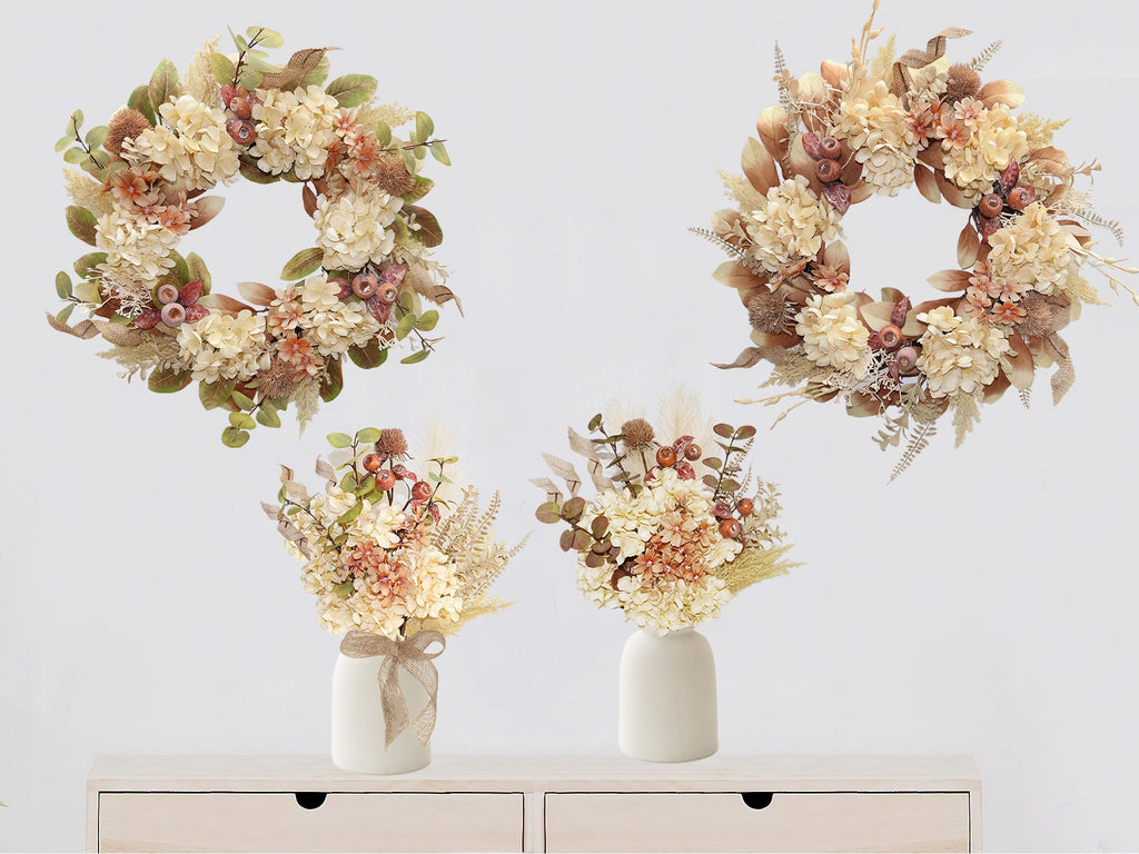 Two fall wreaths and two floral arrangements in vases on a shelf