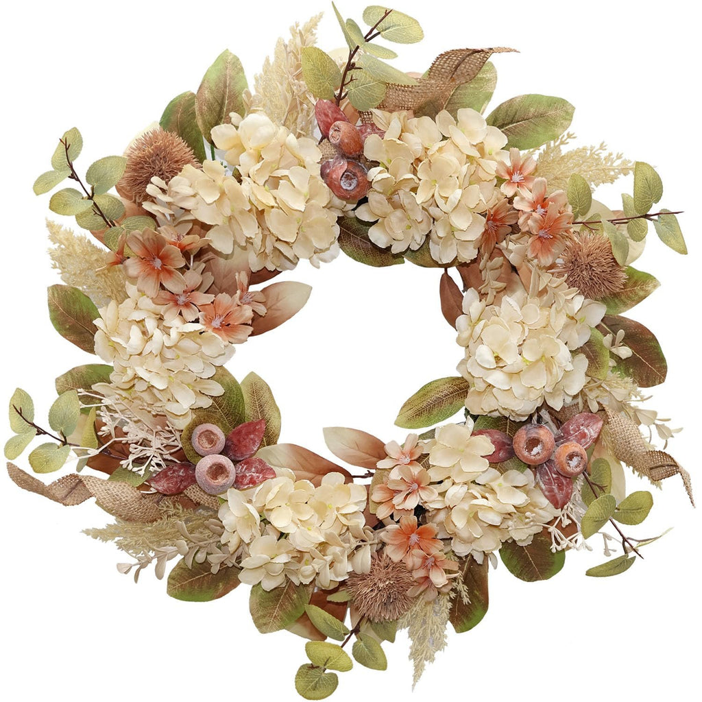 Fall wreath with faux hydrangea, pampas grass, burlap ribbon, and berries on a white background.