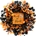 Halloween wreath with orange and black eucalyptus leaves, berries, and a central sign that says 'Trick OR Treat' with a pumpkin graphic.