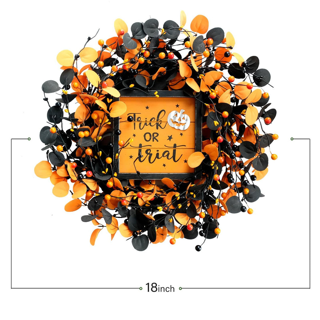 Halloween wreath with orange and black eucalyptus leaves and berries, featuring a central sign that says "Trick OR Treat" with a pumpkin graphic.
