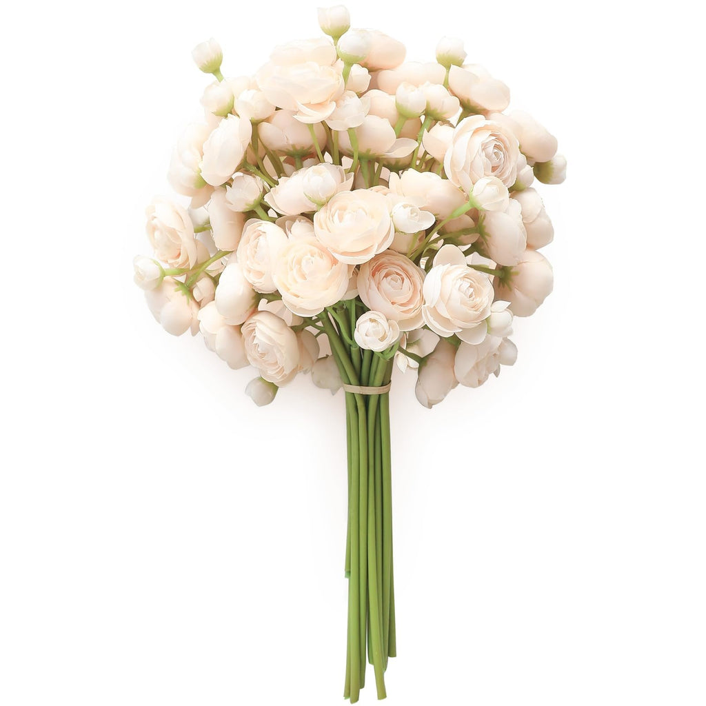 Bouquet of champagne faux silk ranunculus flowers with green stems tied with a band, isolated on white.