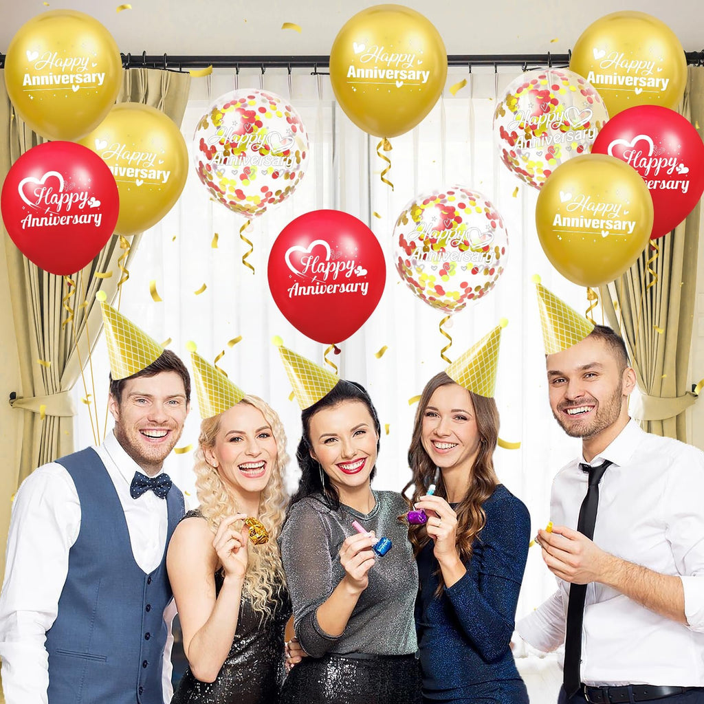 Group of five people celebrating an anniversary with gold, red, and confetti balloons and party hats.