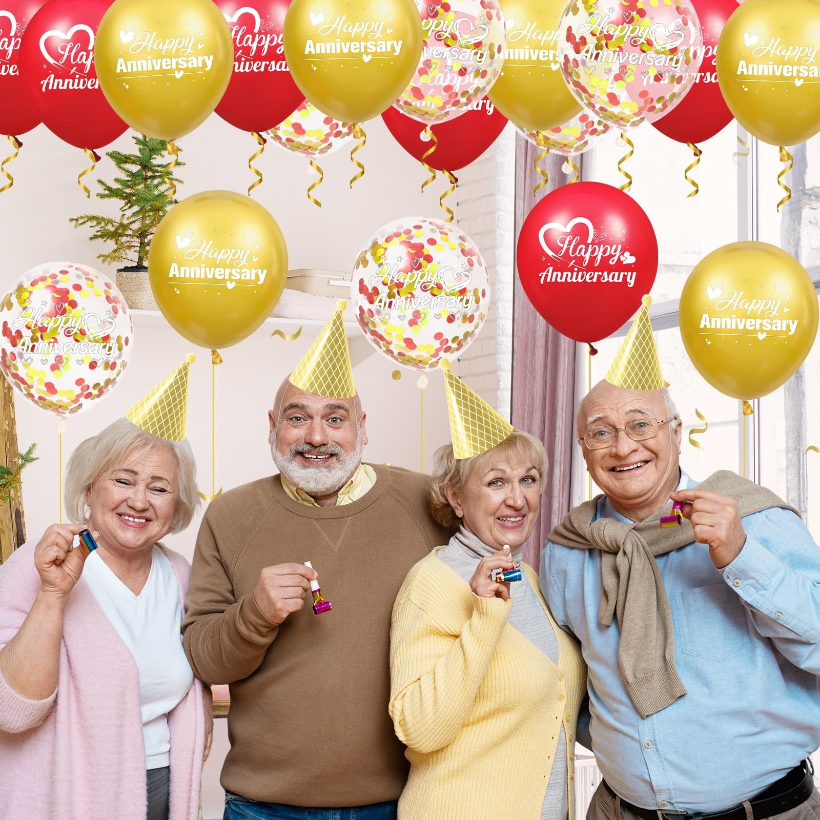 Four smiling seniors wearing party hats and holding party blowers, surrounded by red, gold, and confetti balloons with 'Happy Anniversary' text.