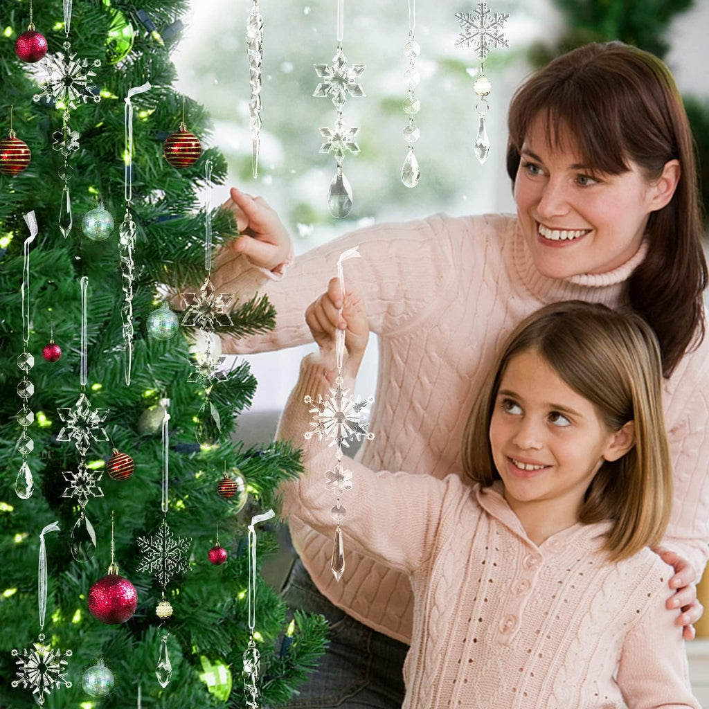Mother and daughter decorating a Christmas tree with acrylic icicle and snowflake ornaments