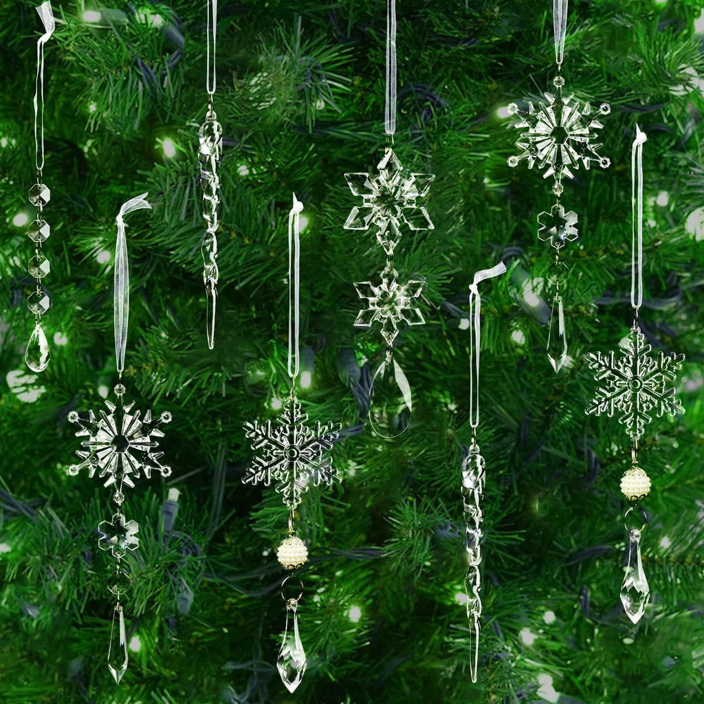 Assortment of clear acrylic Christmas tree ornaments including snowflakes, icicles, and beaded garlands hanging on a decorated tree.