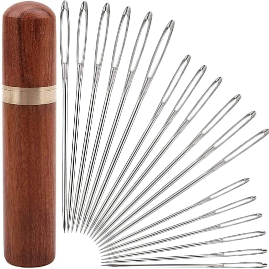 18-piece large-eye sewing needle set with a wooden storage tube, fanned out on a white background.