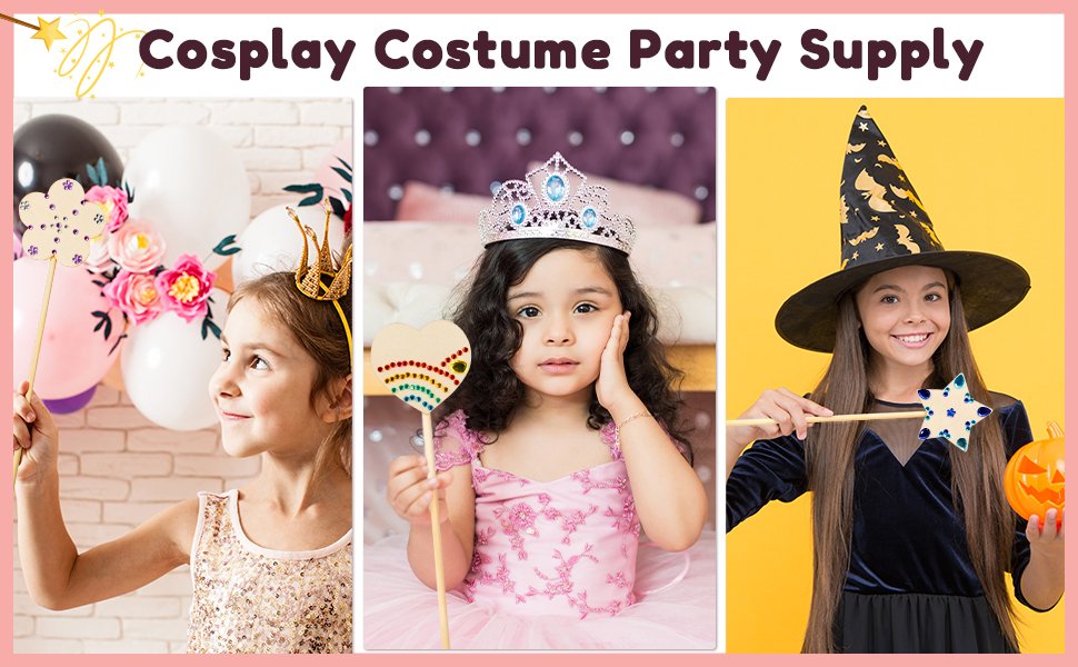 Three girls dressed as a princess and witch holding craft wands, with balloons and a pumpkin.