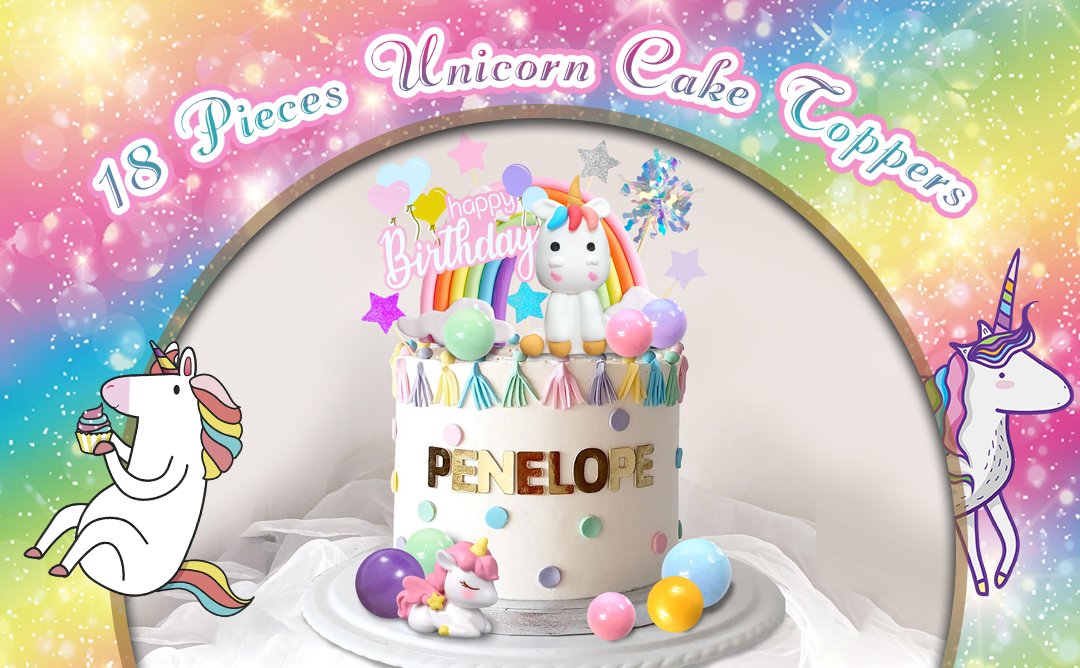 Unicorn rainbow cake toppers set on a decorated cake with 'PENELOPE' spelled out in gold letters.