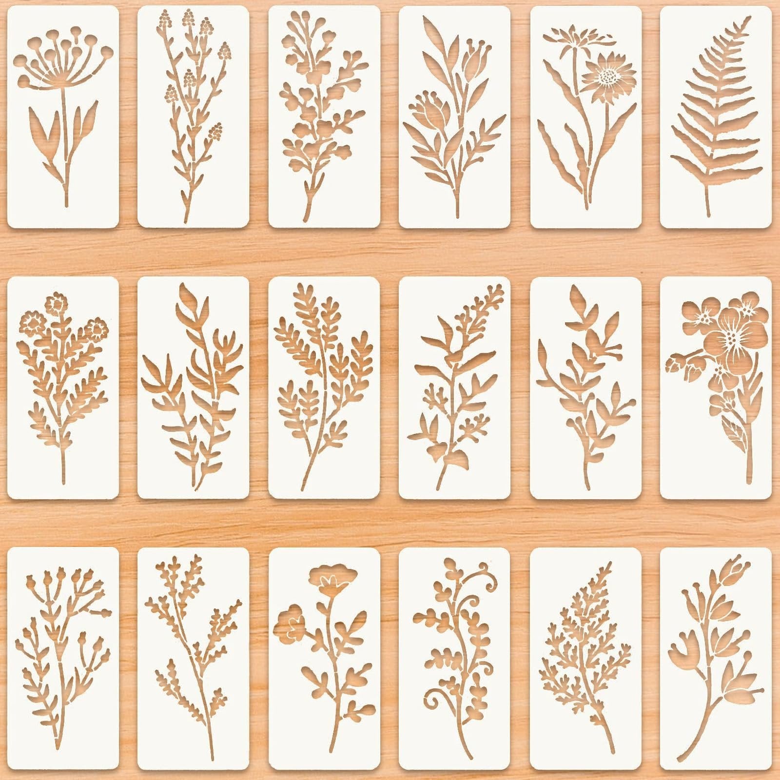 Set of 18 reusable floral stencils with leaf vine designs on a wooden background.