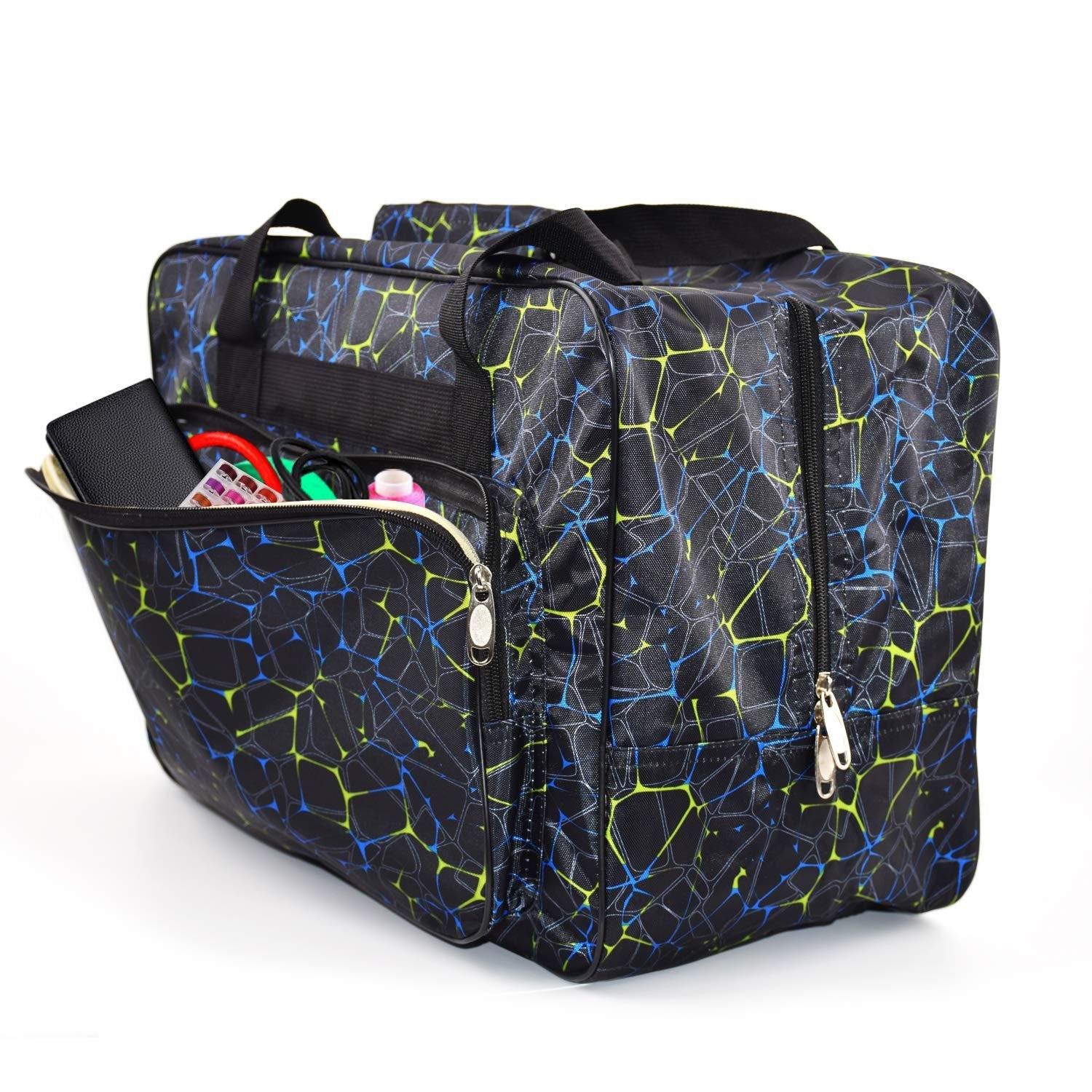 Black canvas sewing machine carrying case with blue and green geometric pattern, open front pocket showing contents.