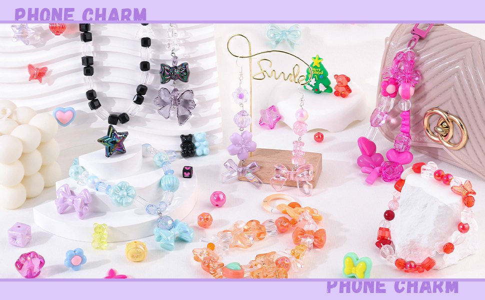 Assorted acrylic beads and charms in various shapes including flowers, bows, gummy bears, and stars, arranged in jewelry designs.