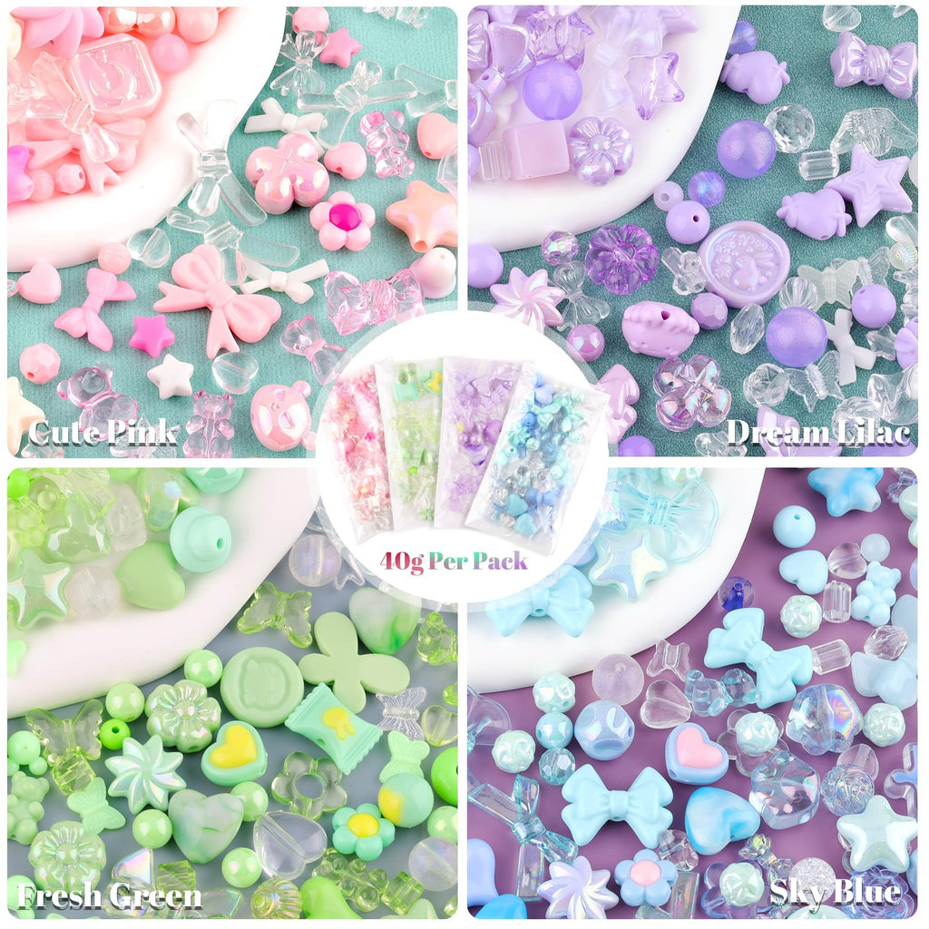 Assorted acrylic beads in pink, purple, green, and blue, featuring charms like bows, flowers, stars, and gummy bears.