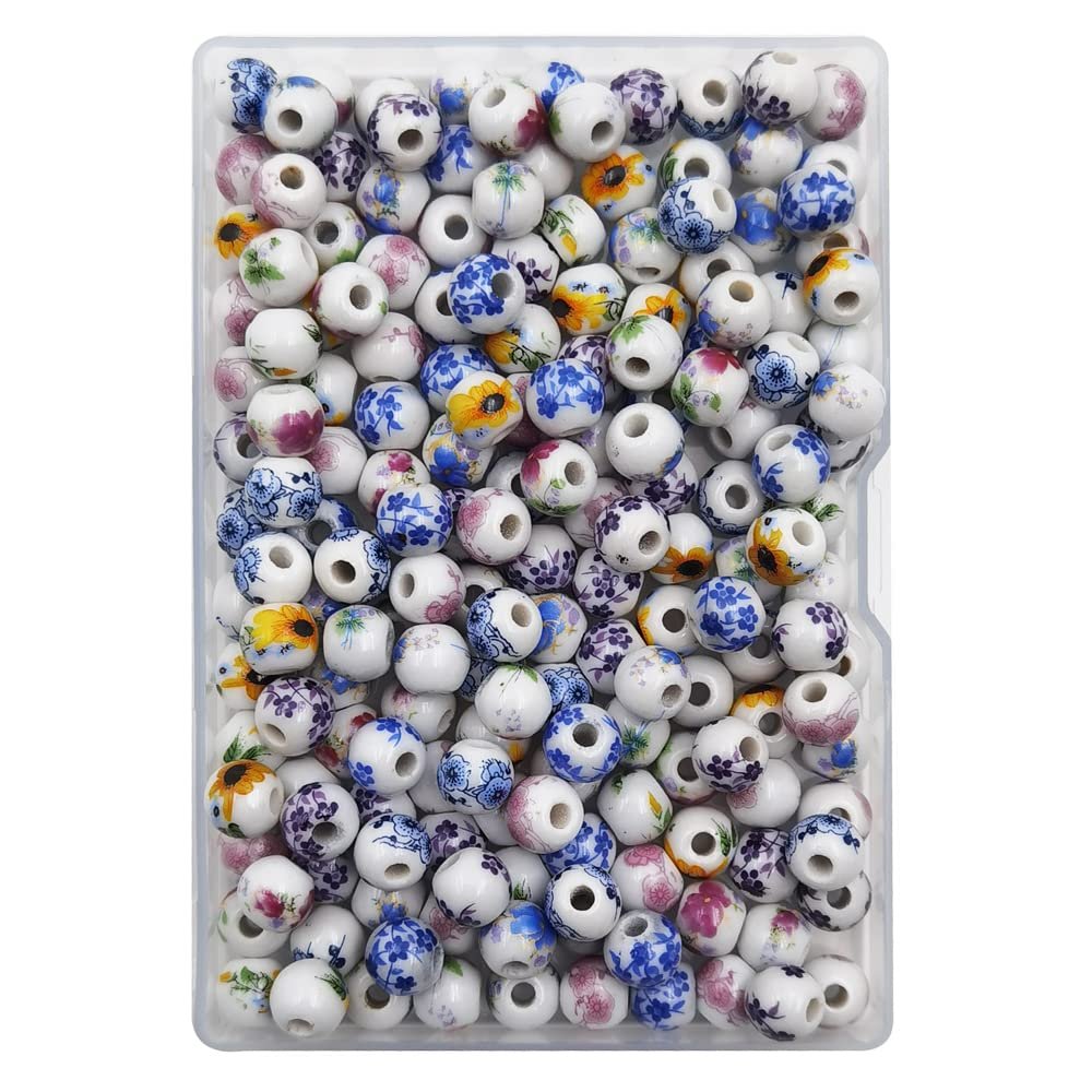 A clear plastic container filled with assorted 8mm round porcelain beads featuring floral patterns in blue, pink, and yellow.