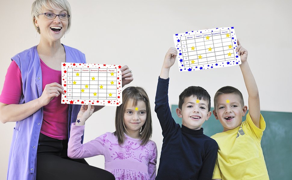 Teacher and three children holding up charts with yellow stars, celebrating achievements.