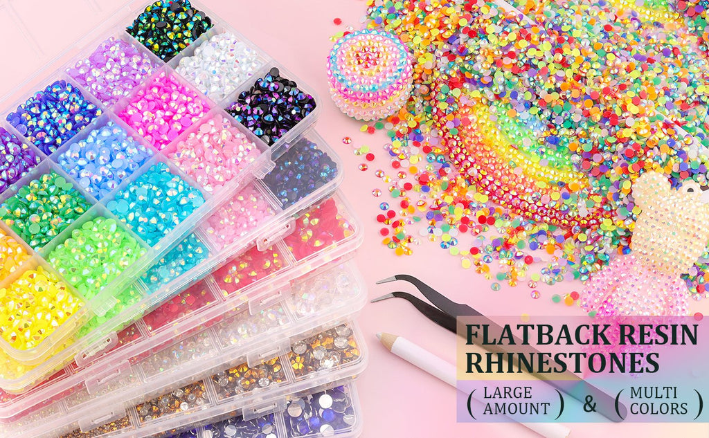 Assorted colorful flatback resin rhinestones in divided containers with tweezers and a pickup pen, plus a rainbow design.