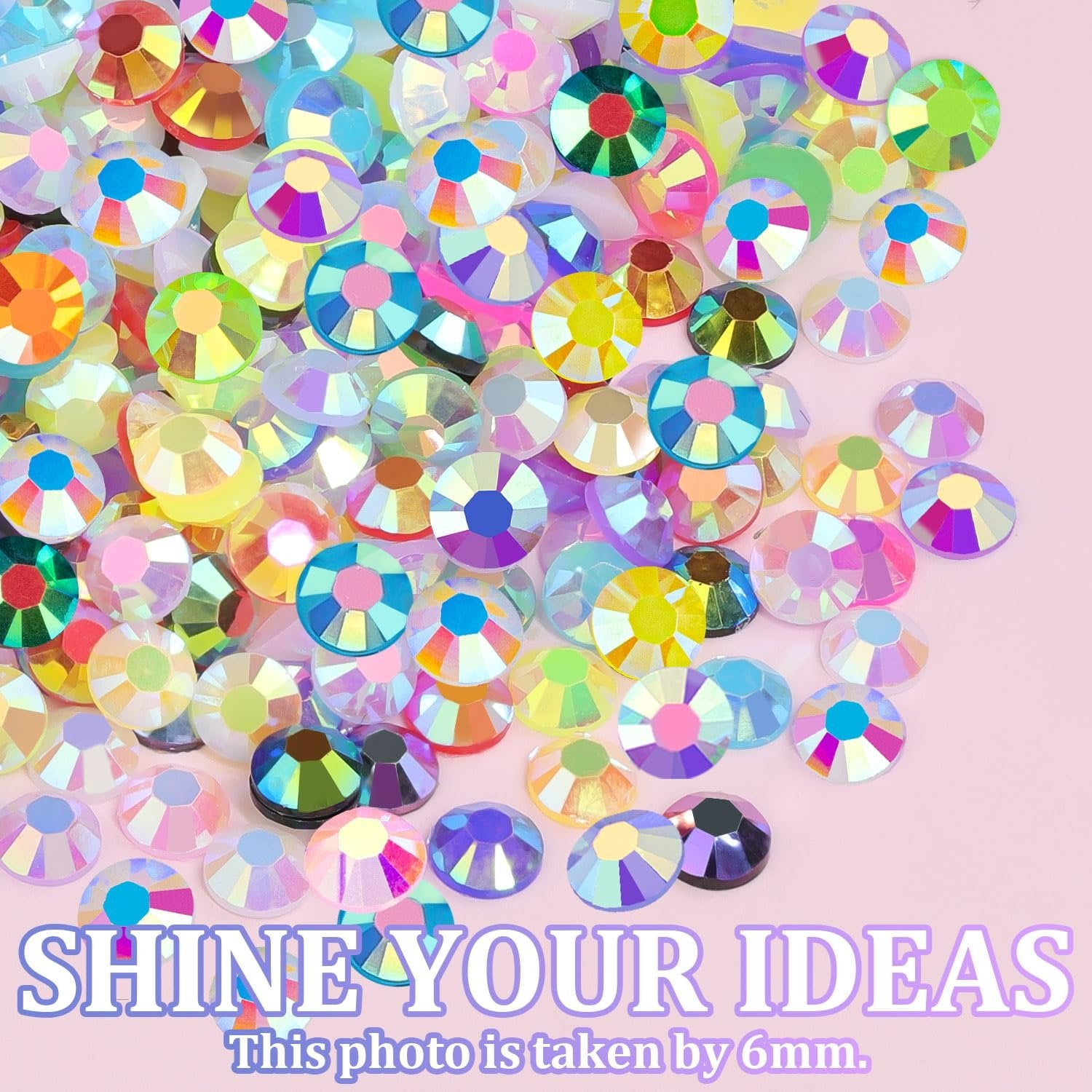 Mixed-color flatback resin jelly rhinestones scattered on a pink background with marketing text.