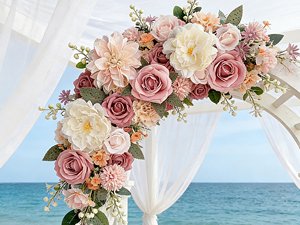 Dusty blush pink artificial rose bouquet arrangement on white arbor with ocean background