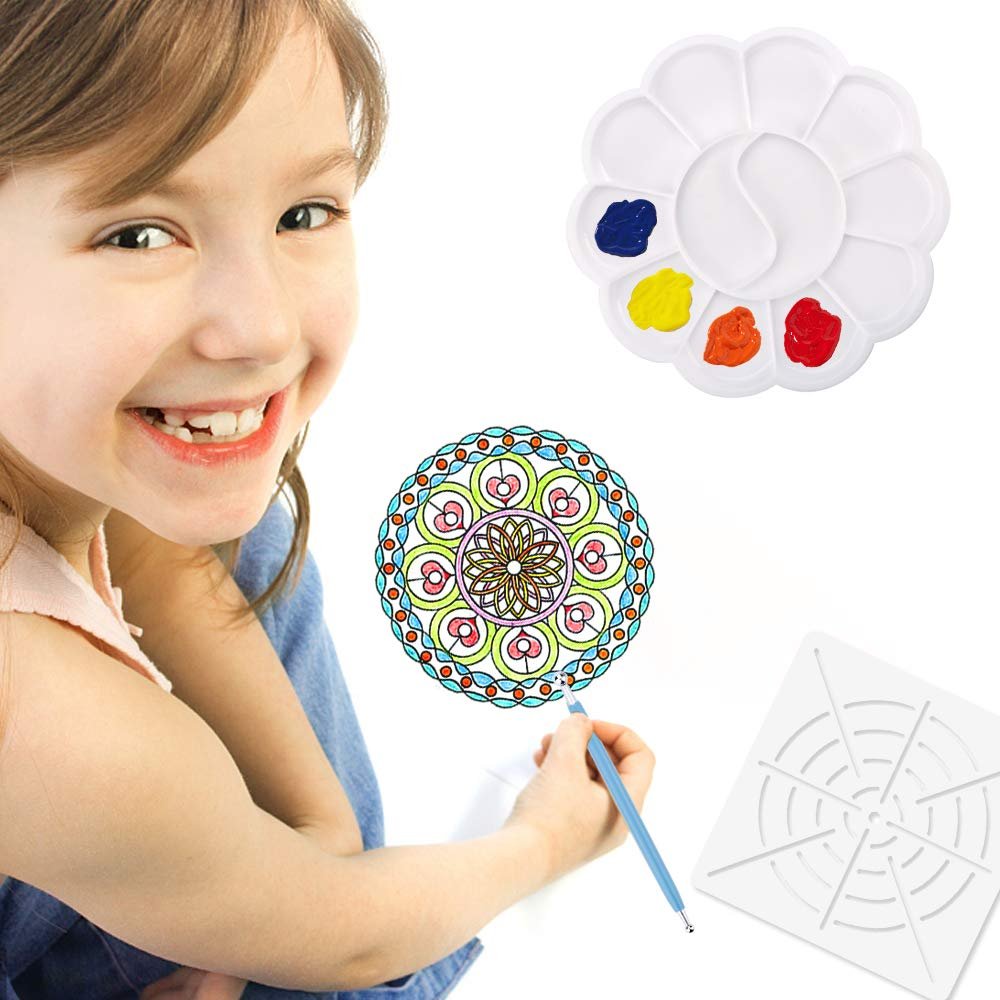 Smiling child using a mandala dotting tool on a colorful mandala design with a paint palette and stencil nearby