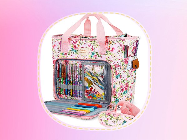 Floral crochet storage bag with organized hooks, needles, and accessories, open front pocket showing yarn and tools.